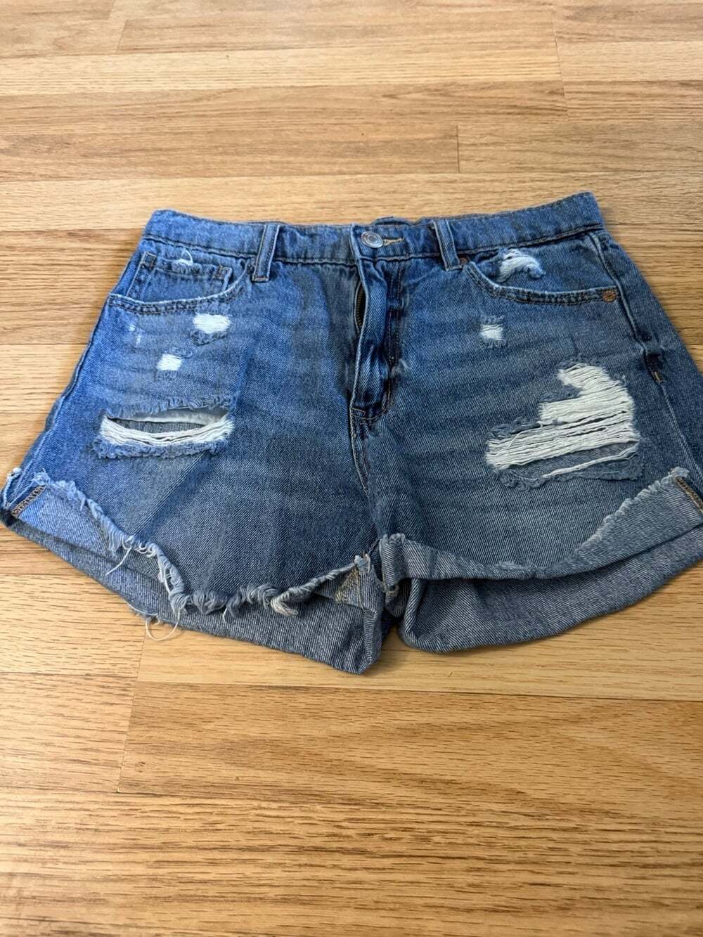 Women's distressed denim shorts with cuffed hem